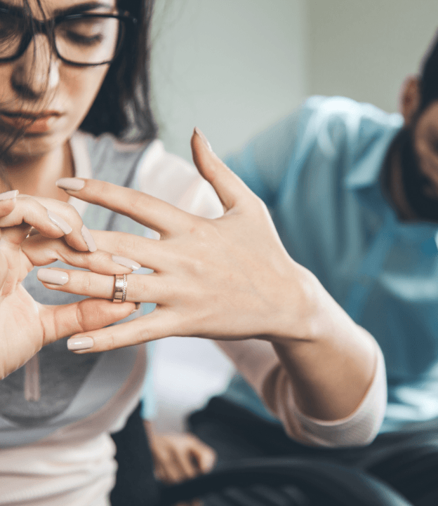 Woman removing wedding ring after divorce by blair parker law in houston, texas.