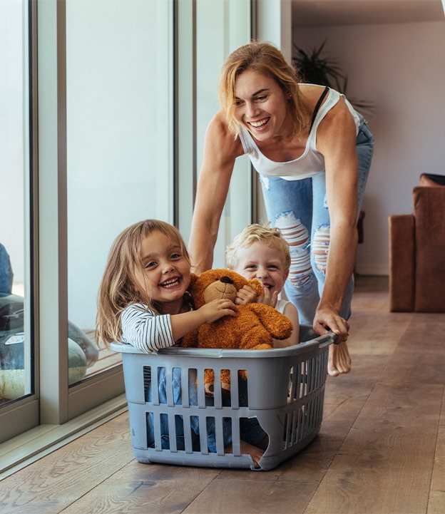 Woman spending time with son and daughter by blair parker law in houston, texas.