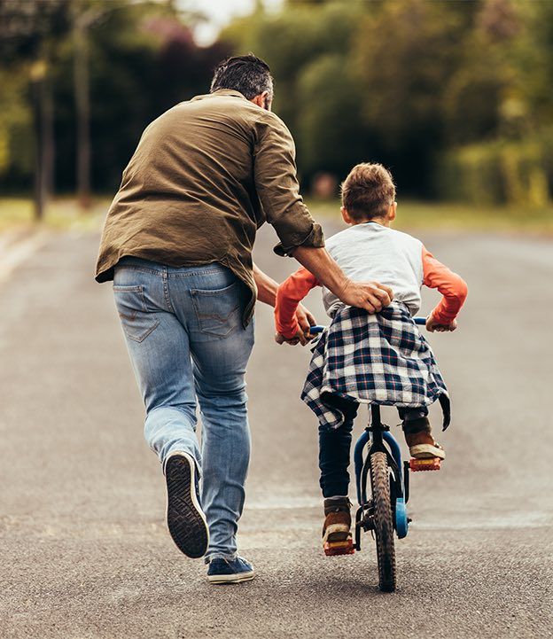 Father and son spending time together by blair parker law in houston, texas.