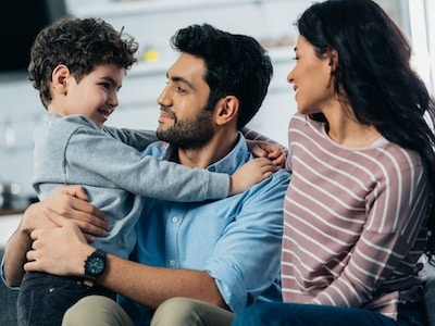 Husband and wife talking to child after consulting with child custody lawyer by blair parker law in houston, texas.