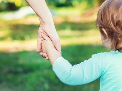 Parent walking with child wondering how often child support can be modified in Texas by Blair Parker Law in houston, texas.