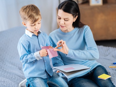 Mother playing with son while concerned about whether guardianship overrides parental rights in Texas