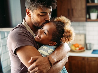 Parent holding child after learning how to get full custody of a child in Texas