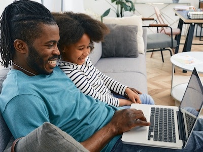Father playing with daughter after working with family law lawyer to protect his parental rights