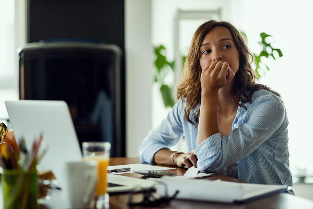 A young woman going through an uncontested divorce in Texas doing research on her computer