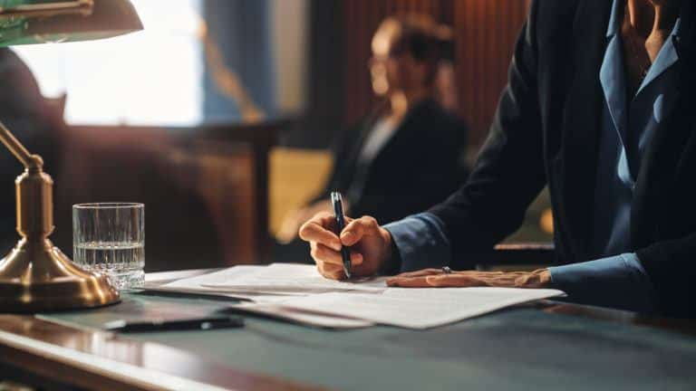 An attorney seated at their desk preparing to file a motion to enforce an order in Texas