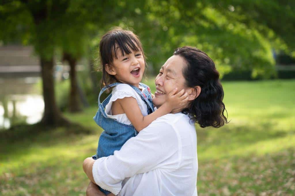 A grandmother playing with her grandchild after her parents learned about signing over custody to a family member in Texas
