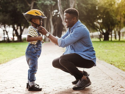 Father plays with son after navigating Texas Standard Possession Order to set a visitation schedule