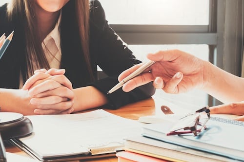 A woman having a consultation with a Katy divorce lawyer