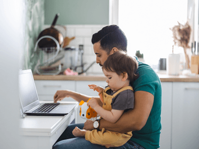 Single parent researching how to modify a no contact order on a laptop