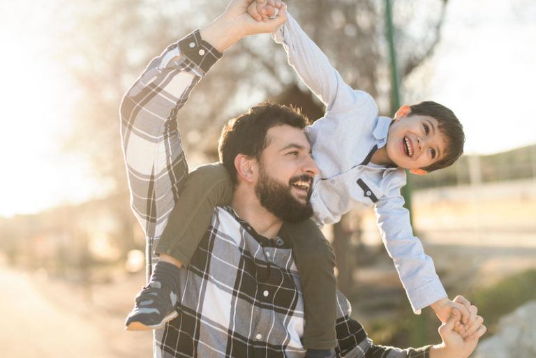 After discussing full custody vs. joint custody in Texas with his attorney, a father walks with his son after establishing joint custody