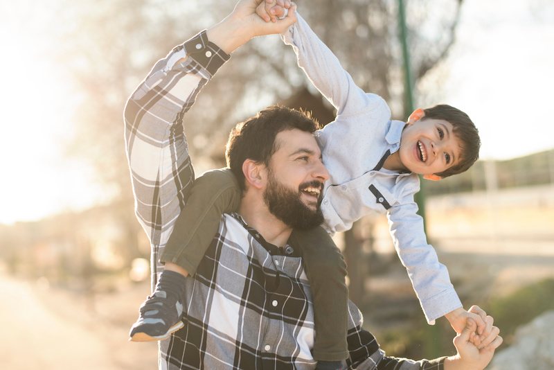 After discussing full custody vs. joint custody in Texas with his attorney, a father walks with his son after establishing joint custody