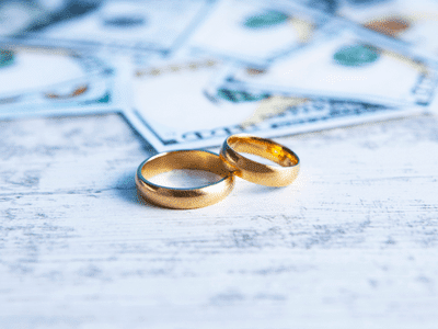 A visual of the cost to file for divorce, with rings and monetary value.