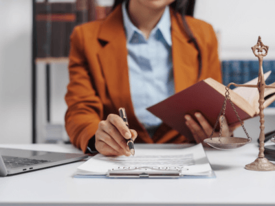 Female lawyer signing documents supporting a victim of domestic violence