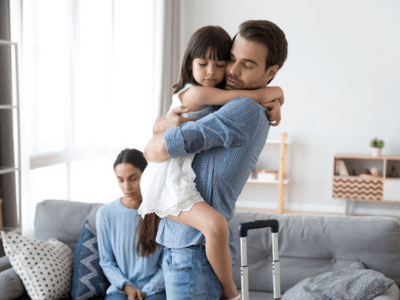 Dad hugging her daughter while saying goodbye