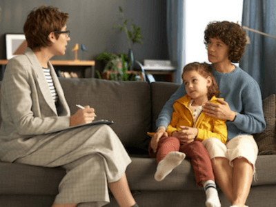 Mom and daughter in a social worker’s office