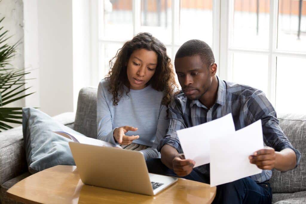 A couple talking to a judge to determine if they can change a divorce agreement
