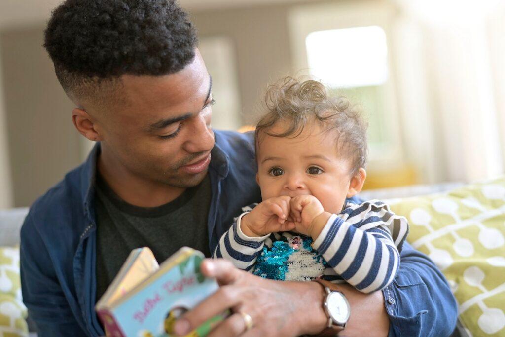 Paternity Rights in Texas That New Fathers Need to Know 3 Dad holding his baby son
